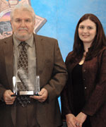 Retired Sergeant Kenneth Whitley (left) of the Garden Grove Police Department accepts his award from Deputy Director Lindsay E. Barsamian-Kelsch, Office of Governor Arnold Schwarzenegger, Fresno Field Office